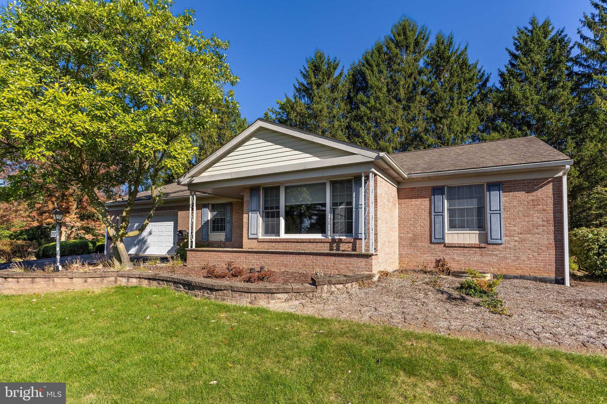 212 Seneca Circle State College, PA 16801 - Photo 29 of 67 a front view of a house with a garden