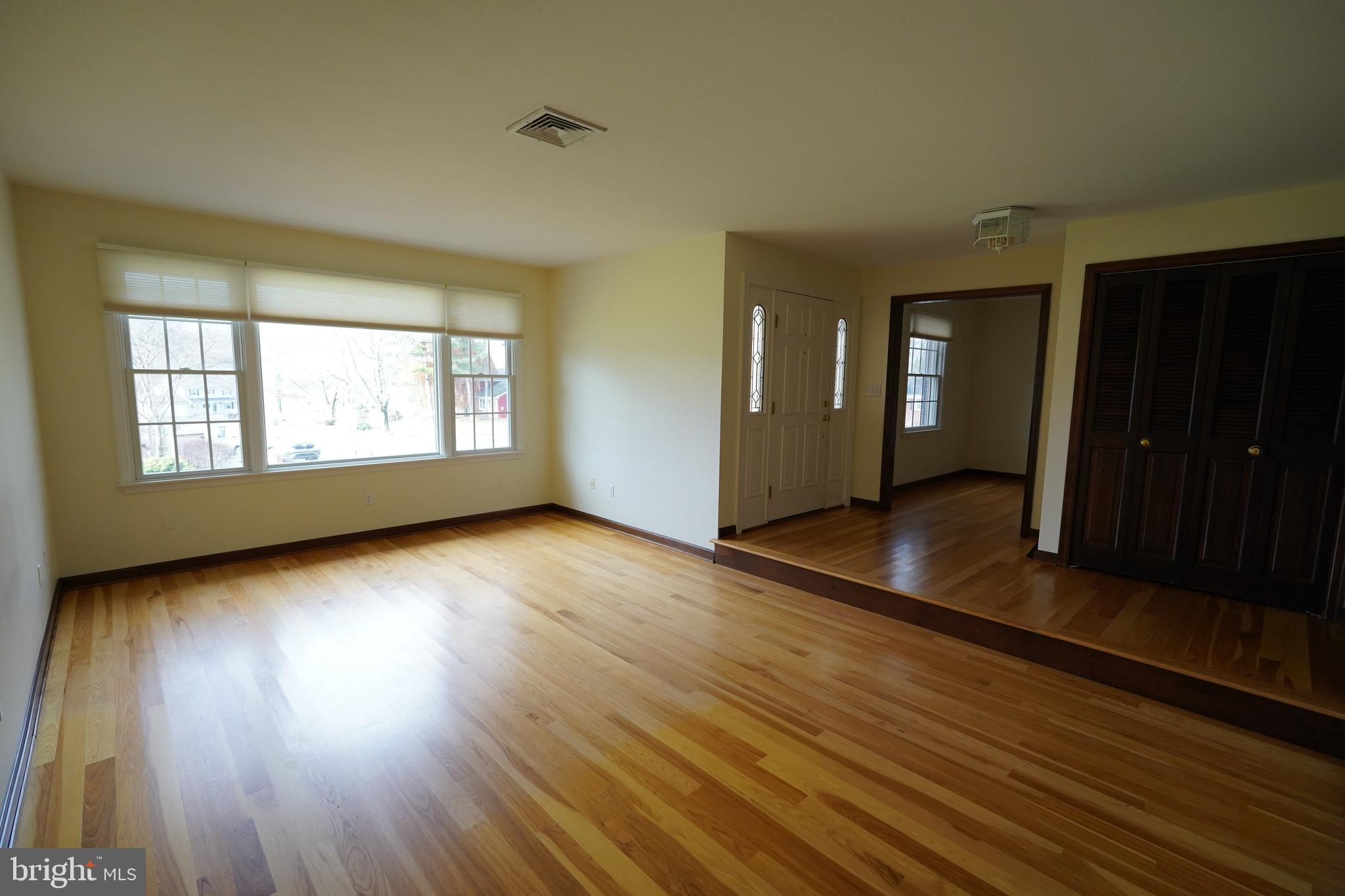 212 Seneca Circle State College, PA 16801 - Photo 3 of 67 an empty room with wooden floor and windows