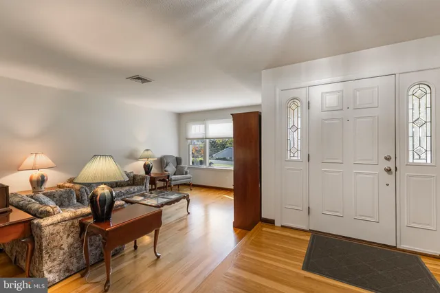 a bedroom with two beds and a table