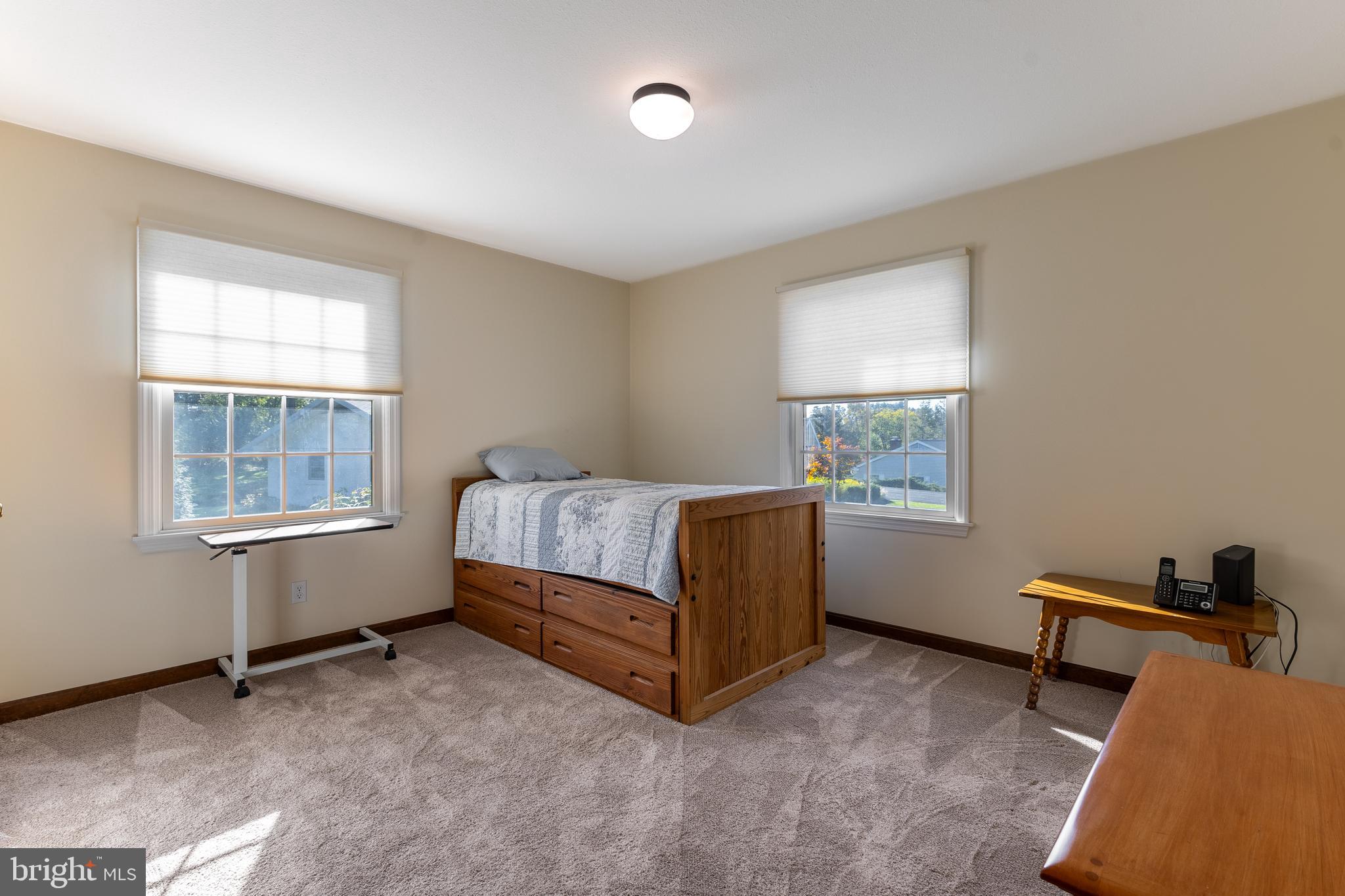 212 Seneca Circle State College, PA 16801 - Photo 41 of 67 a spacious bedroom with a bed and a window