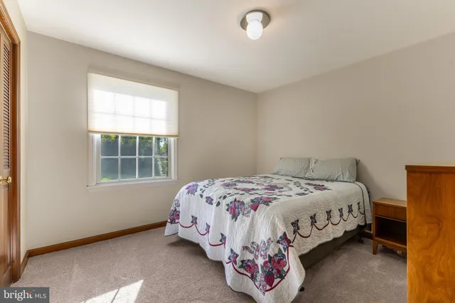 a backyard of a house with barbeque oven table and chairs