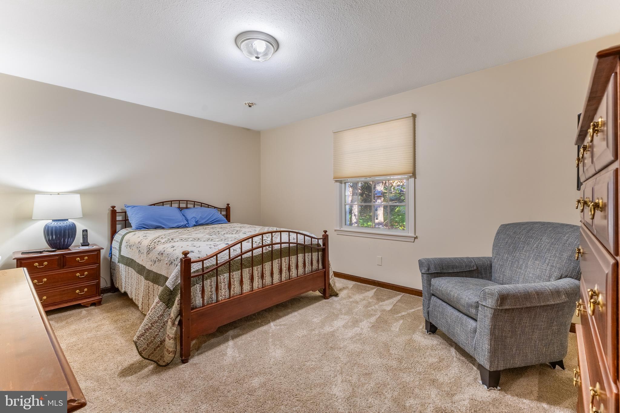 212 Seneca Circle State College, PA 16801 - Photo 46 of 67 a bedroom with a bed and chair