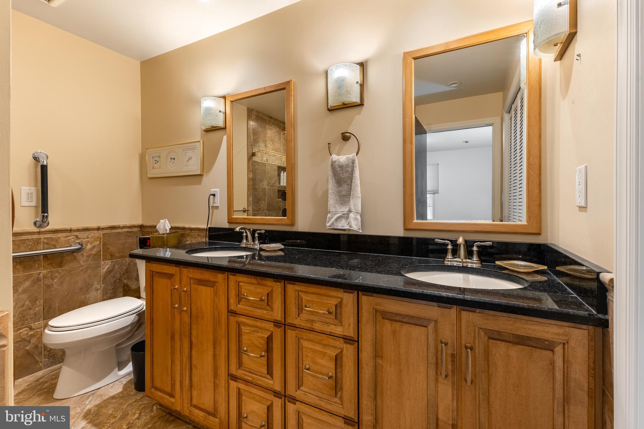 212 Seneca Circle State College, PA 16801 - Photo 47 of 67 a bathroom with a granite countertop sink and a mirror