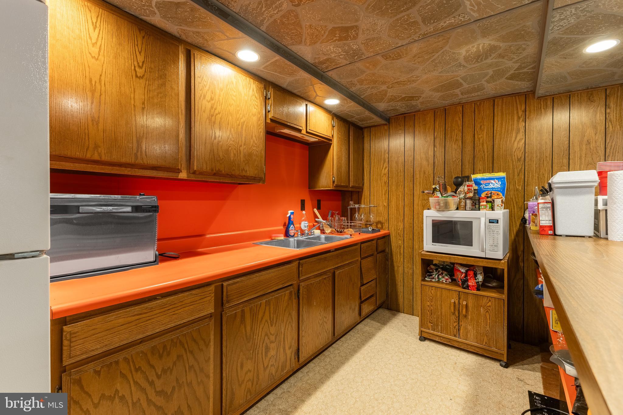 212 Seneca Circle State College, PA 16801 - Photo 52 of 67 a kitchen with stainless steel appliances kitchen island granite countertop a sink and cabinets