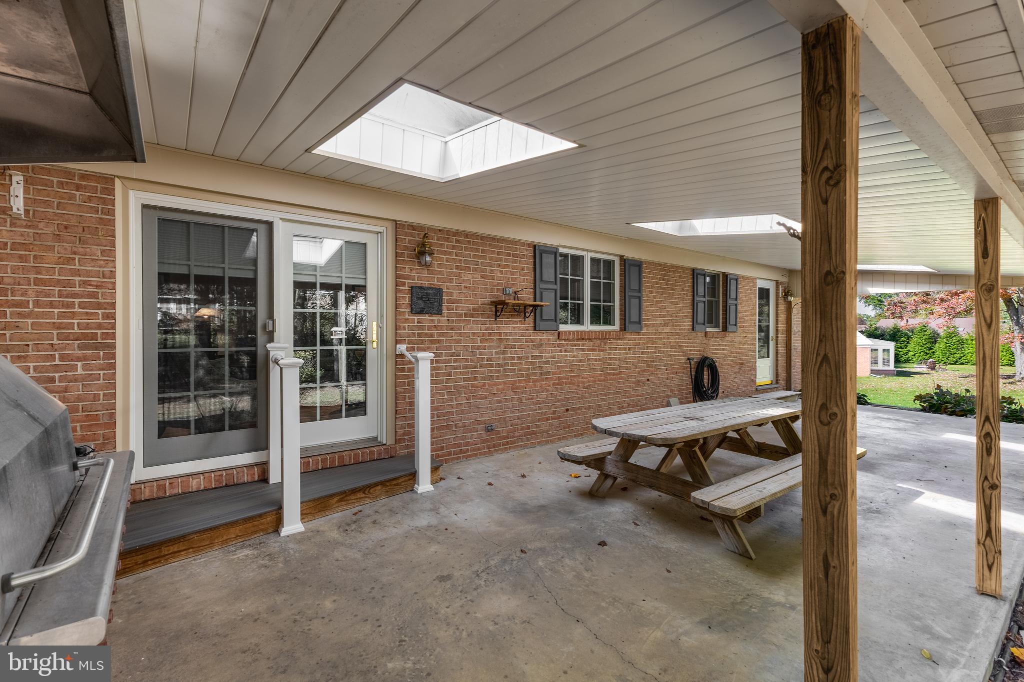 212 Seneca Circle State College, PA 16801 - Photo 61 of 67 a backyard of a house with barbeque oven table and chairs