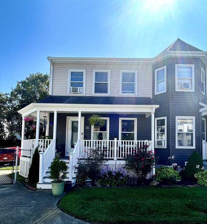 700 2nd Street, Unit 105 Fall River, MA 02721 - Photo 1 of 16 a front view of a house with a yard and potted plants