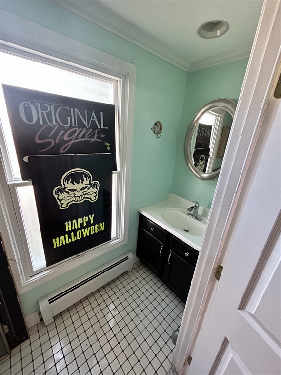 700 2nd Street, Unit 105 Fall River, MA 02721 - Photo 15 of 16 a bathroom with a sink and a mirror