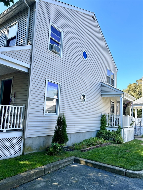 700 2nd Street, Unit 105 Fall River, MA 02721 - Photo 6 of 16 a front view of a house with a yard