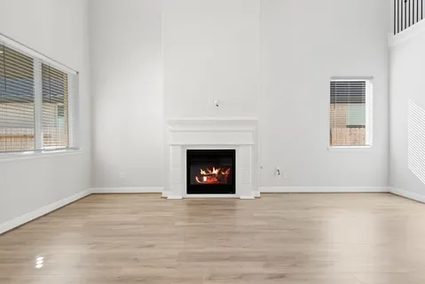 a view of kitchen with wooden floor and window