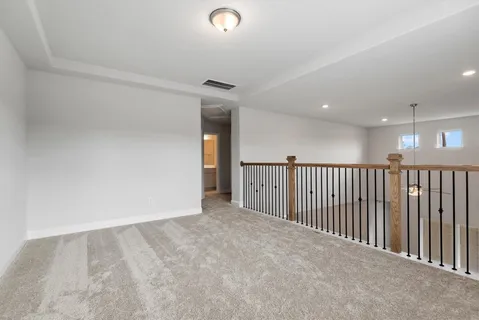 a view of an empty room with stairs