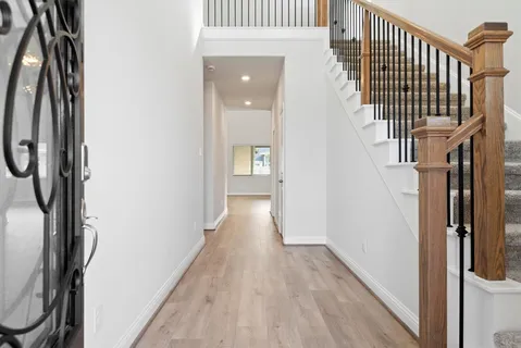 a view of hallway with stairs