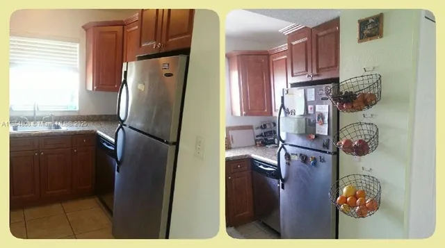 a kitchen with refrigerator and window