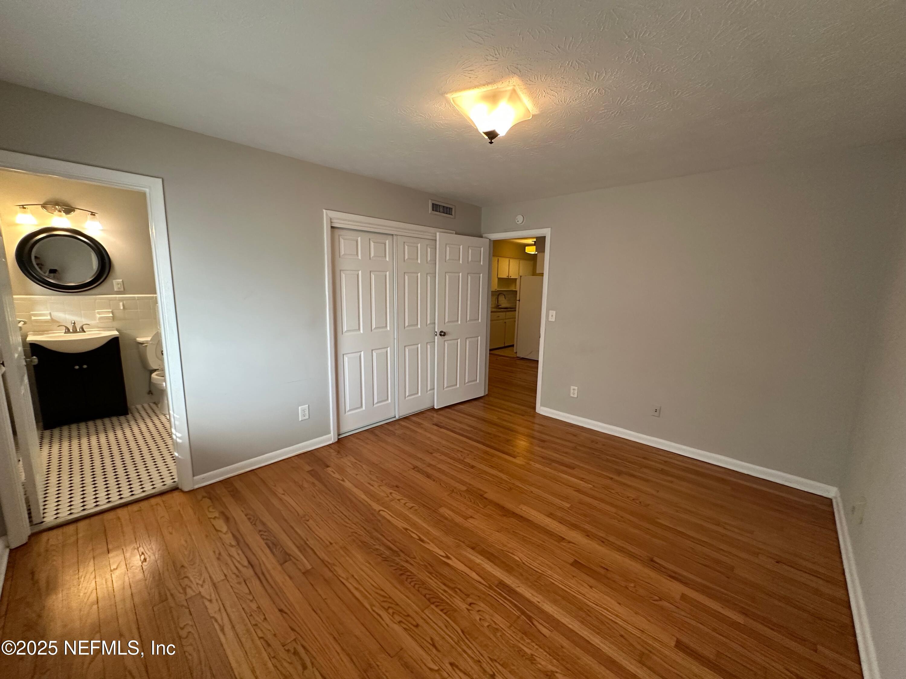 1120 Cedar Street, Unit F Jacksonville, FL 32207 - Photo 19 of 19 a view of a livingroom with wooden floor