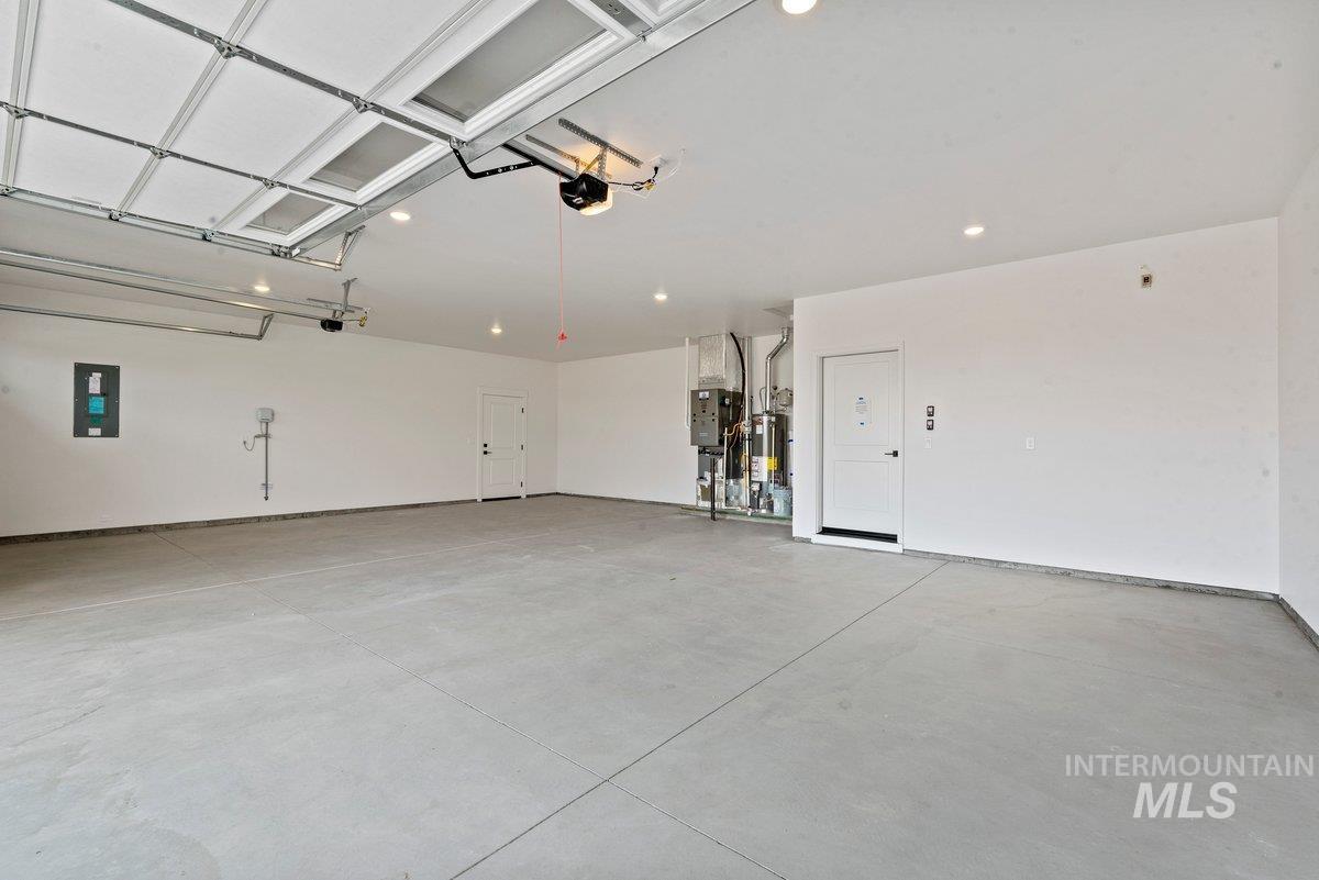2025 West Bittern Street Nampa, ID 83686 - Photo 28 of 32 Garage with electric panel and water heater