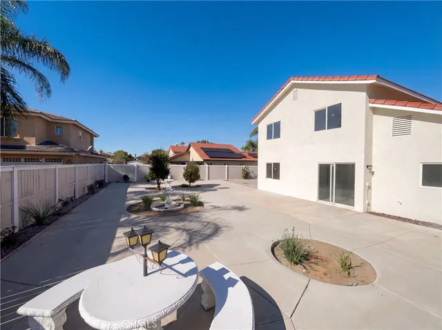 a view of a patio with table and chairs with wooden floor