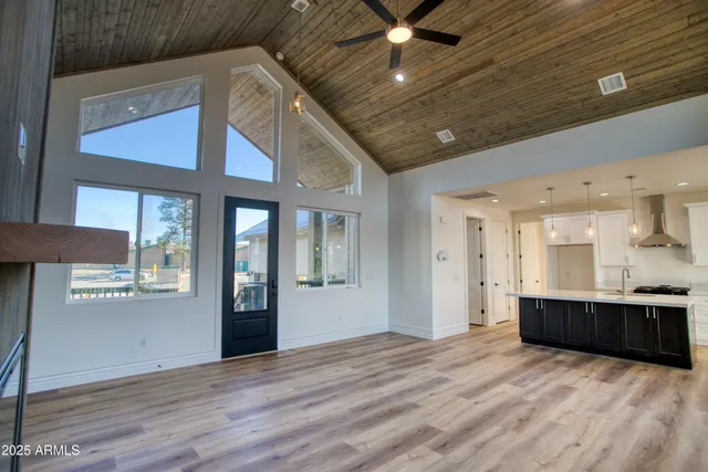 a kitchen with a sink a refrigerator and window