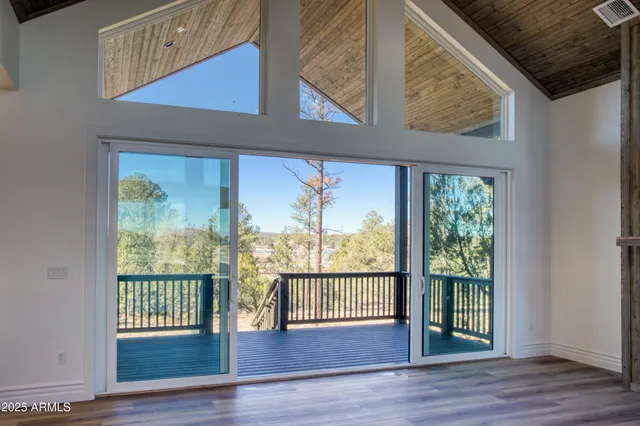 a view of kitchen with granite countertop cabinets and outdoor space