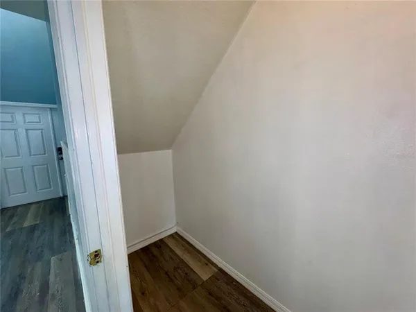 a kitchen with a refrigerator a stove top oven a sink and cabinets