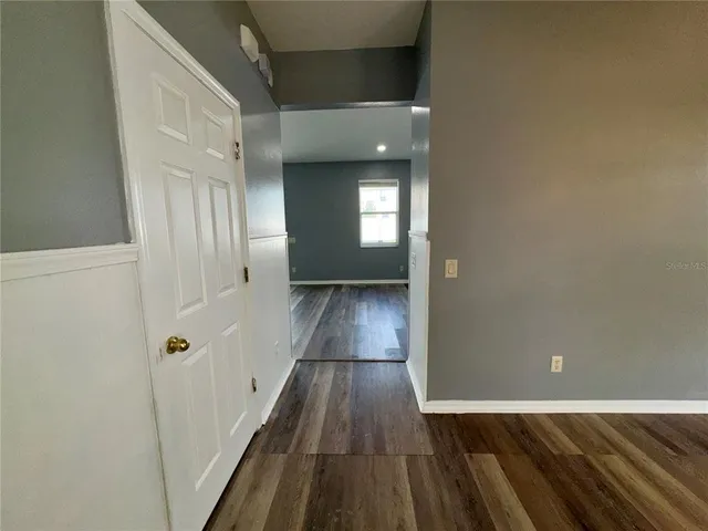 a kitchen with a refrigerator and a stove top oven