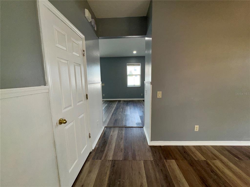 18403 Fish Loop Land O Lakes, FL 34638 - Photo 16 of 64 a view of a hallway with wooden floor and staircase