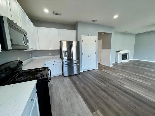 a view of a livingroom with wooden floor