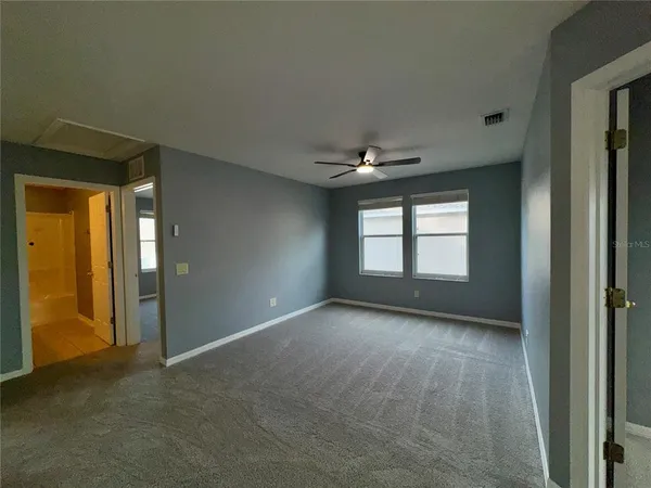 a bathroom with a shower and a sink