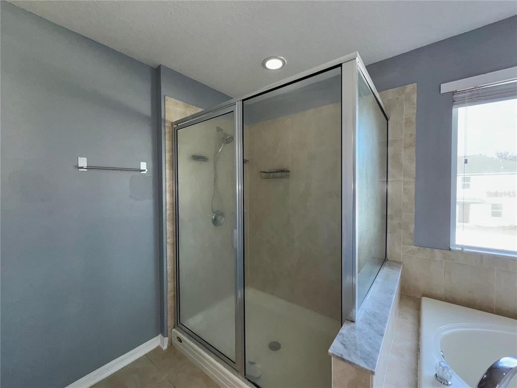 18403 Fish Loop Land O Lakes, FL 34638 - Photo 41 of 64 a bathroom with a shower and a toilet