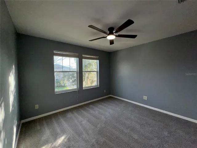 a backyard of a house with lots of green space