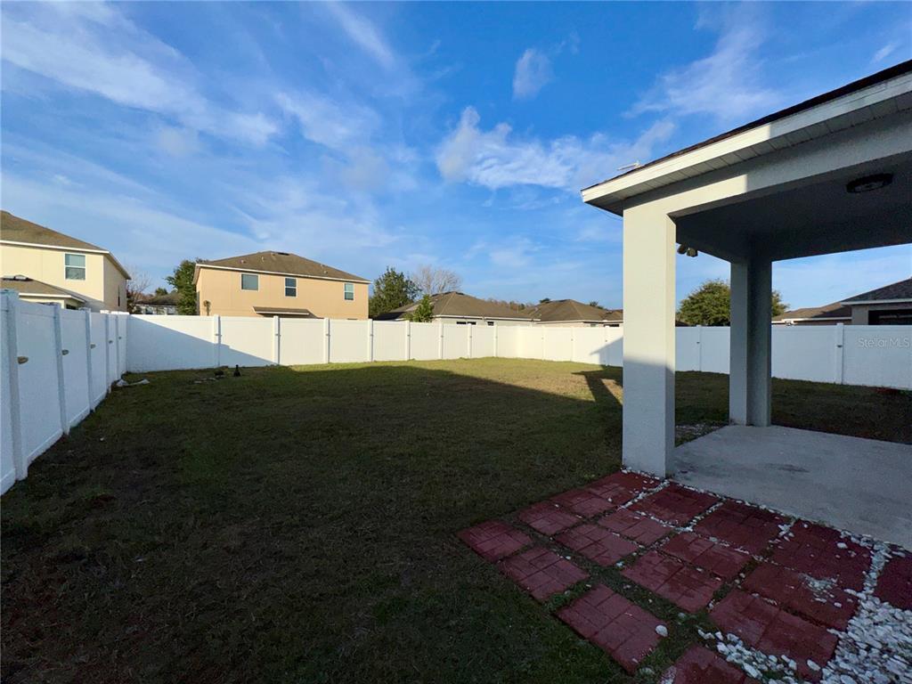 18403 Fish Loop Land O Lakes, FL 34638 - Photo 63 of 64 a front view of a house with a yard