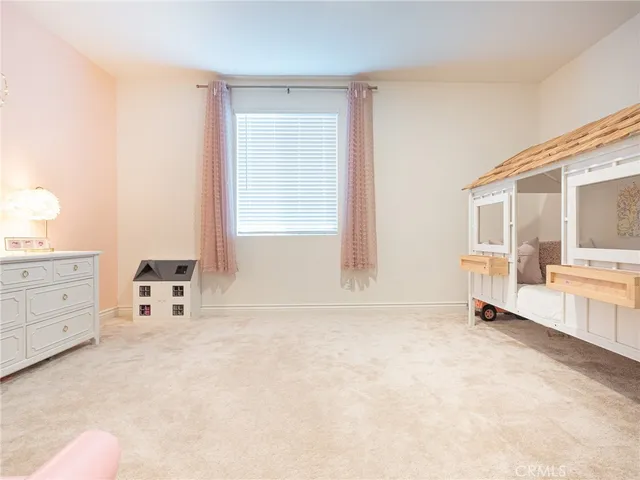 a view of walk in closet with clothes