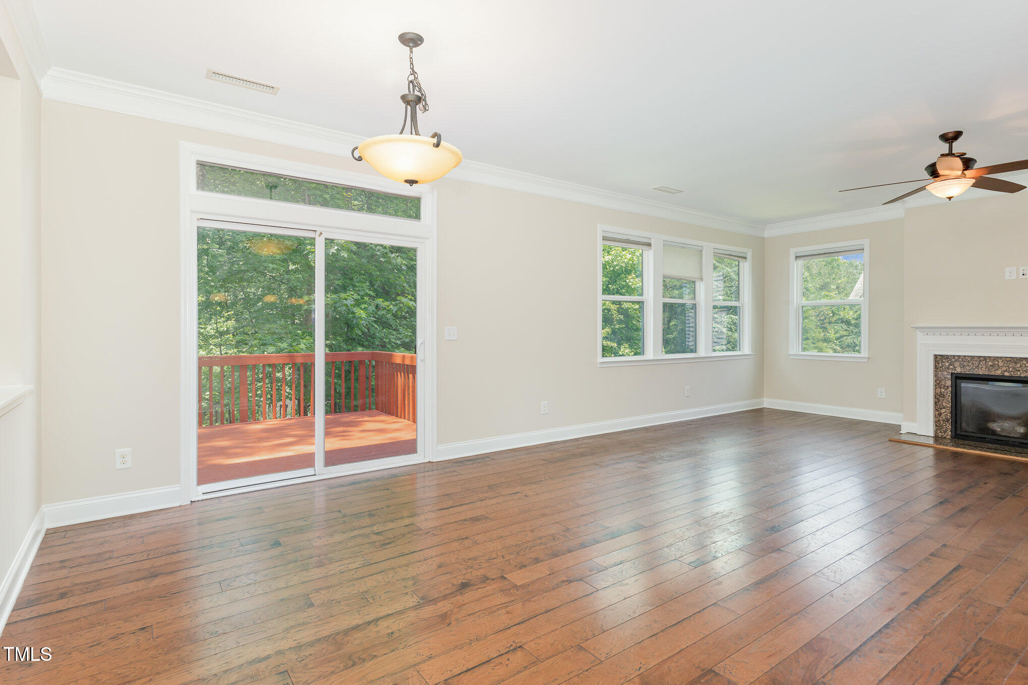 1304 Barnford Mill Road Wake Forest, NC 27587 - Photo 9 of 40 an empty room with wooden floor and windows