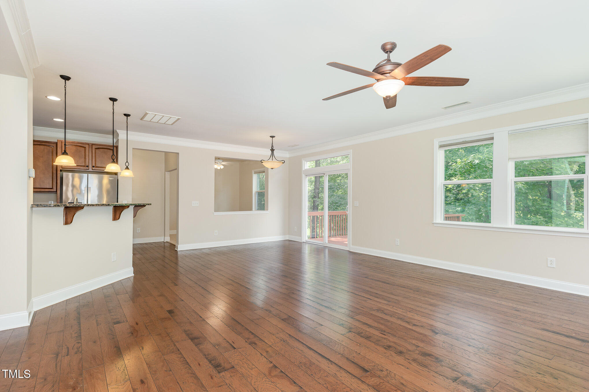 1304 Barnford Mill Road Wake Forest, NC 27587 - Photo 11 of 40 a view of an empty room with wooden floor and a window