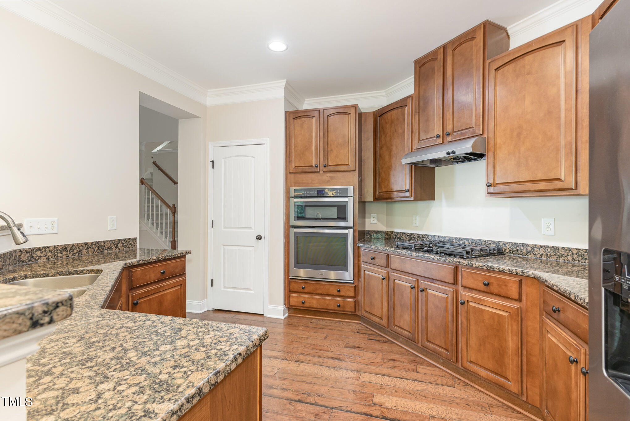 1304 Barnford Mill Road Wake Forest, NC 27587 - Photo 15 of 40 a kitchen with granite countertop wooden cabinets and granite counter tops