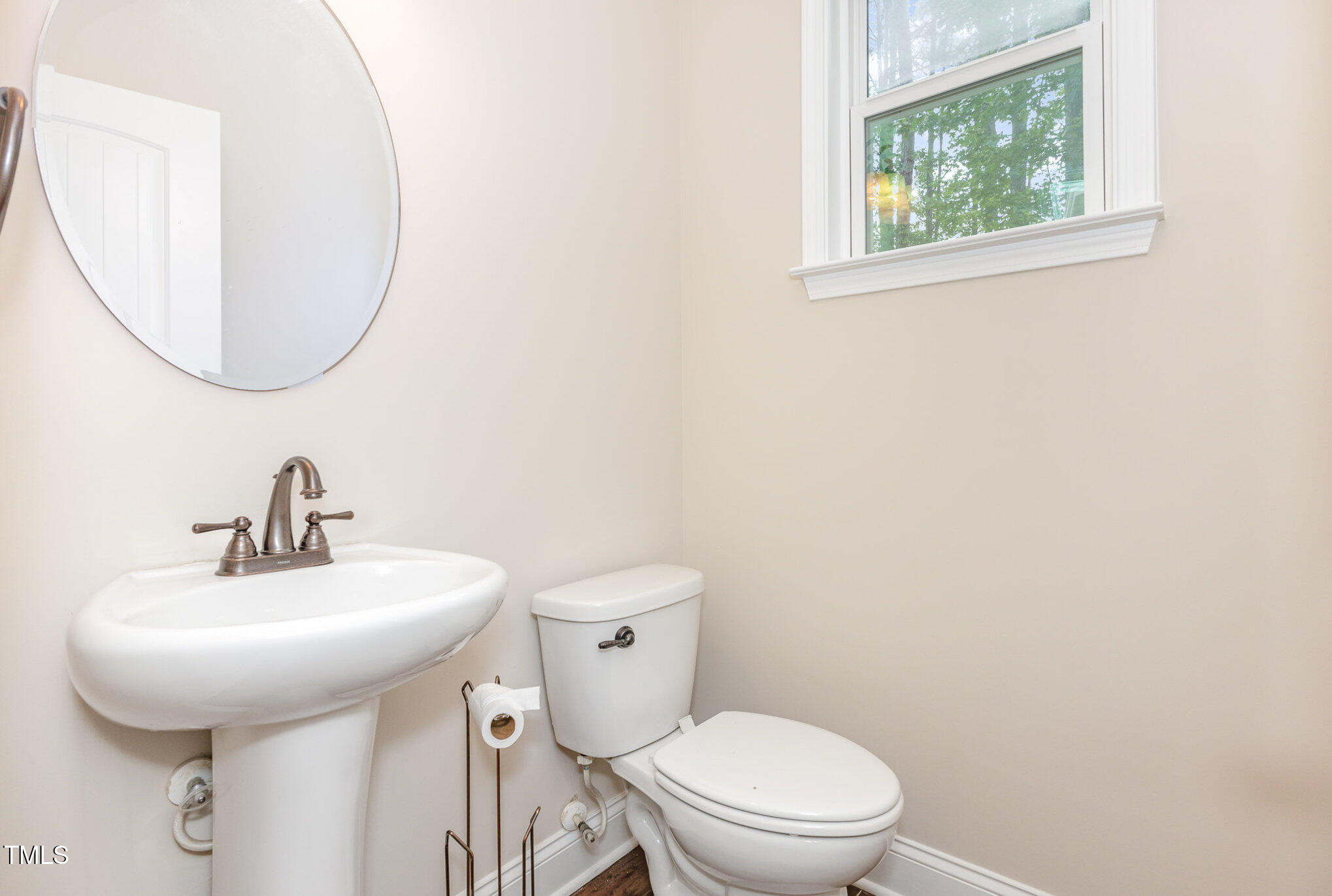 1304 Barnford Mill Road Wake Forest, NC 27587 - Photo 17 of 40 a bathroom with a toilet sink and mirror