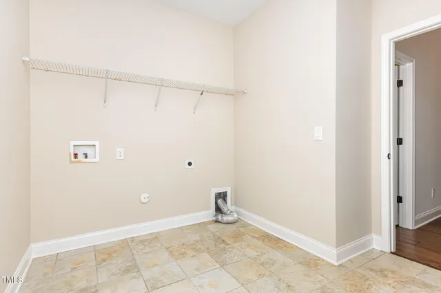 a kitchen with sink refrigerator and window