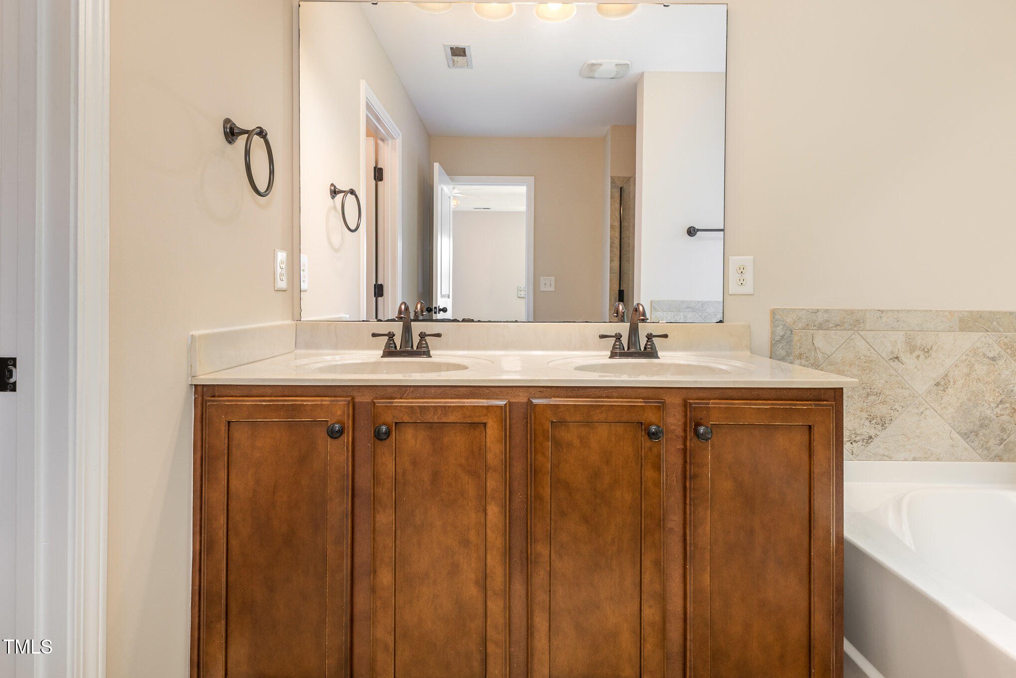 1304 Barnford Mill Road Wake Forest, NC 27587 - Photo 22 of 40 a bathroom with a granite countertop sink and a mirror