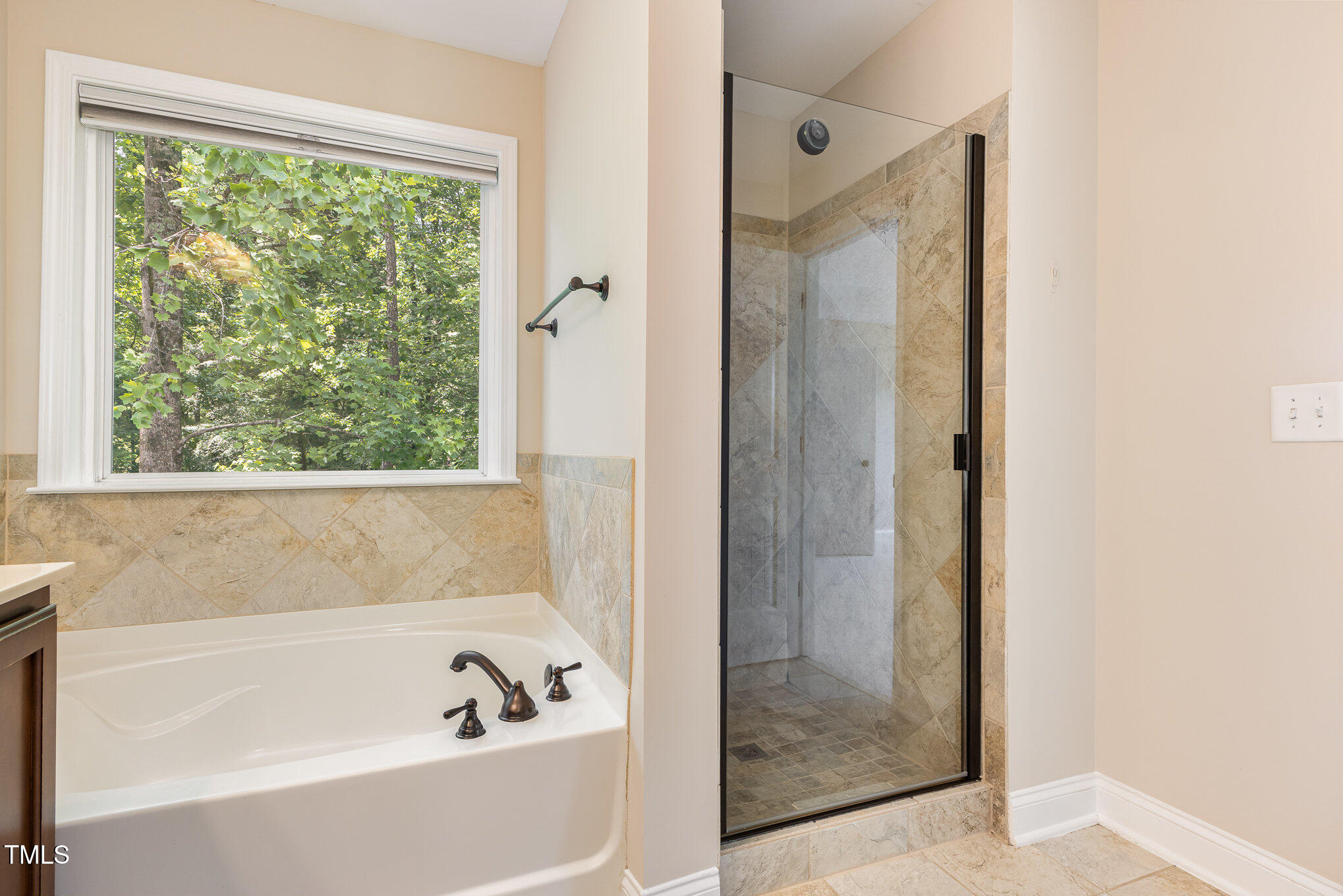 1304 Barnford Mill Road Wake Forest, NC 27587 - Photo 23 of 40 a bathroom with a bathtub and shower