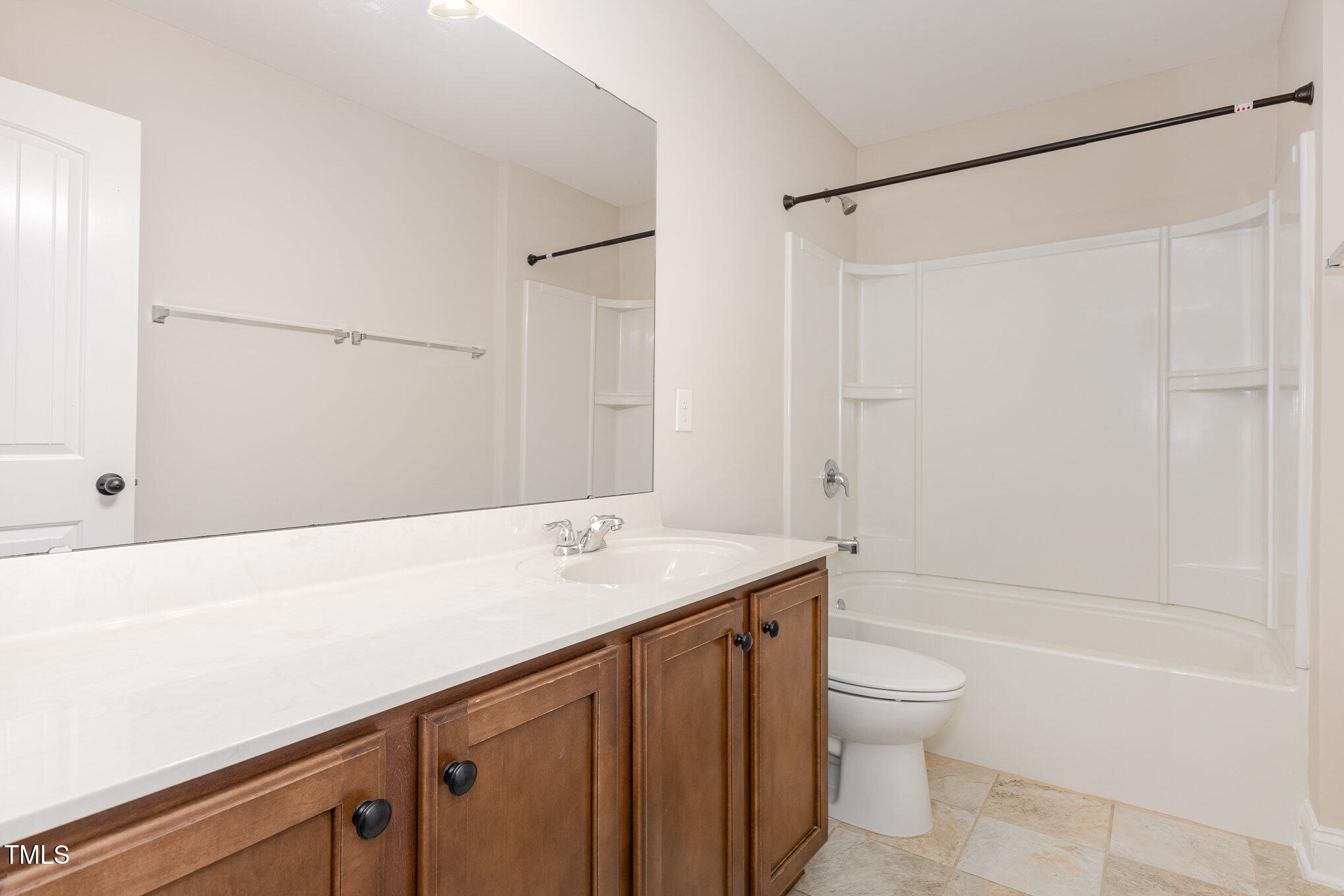 1304 Barnford Mill Road Wake Forest, NC 27587 - Photo 26 of 40 a bathroom with a sink a toilet and shower