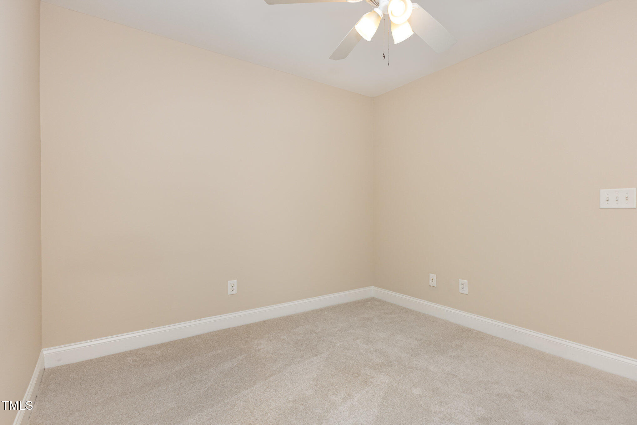 1304 Barnford Mill Road Wake Forest, NC 27587 - Photo 30 of 40 an empty room with a chandelier fan
