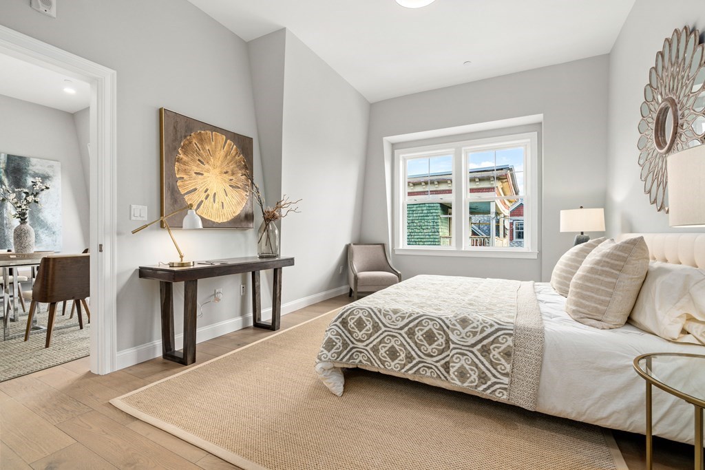 54 Pleasant Street, Unit 5 Boston, MA 02125 - Photo 11 of 23 a bedroom with a bed and window