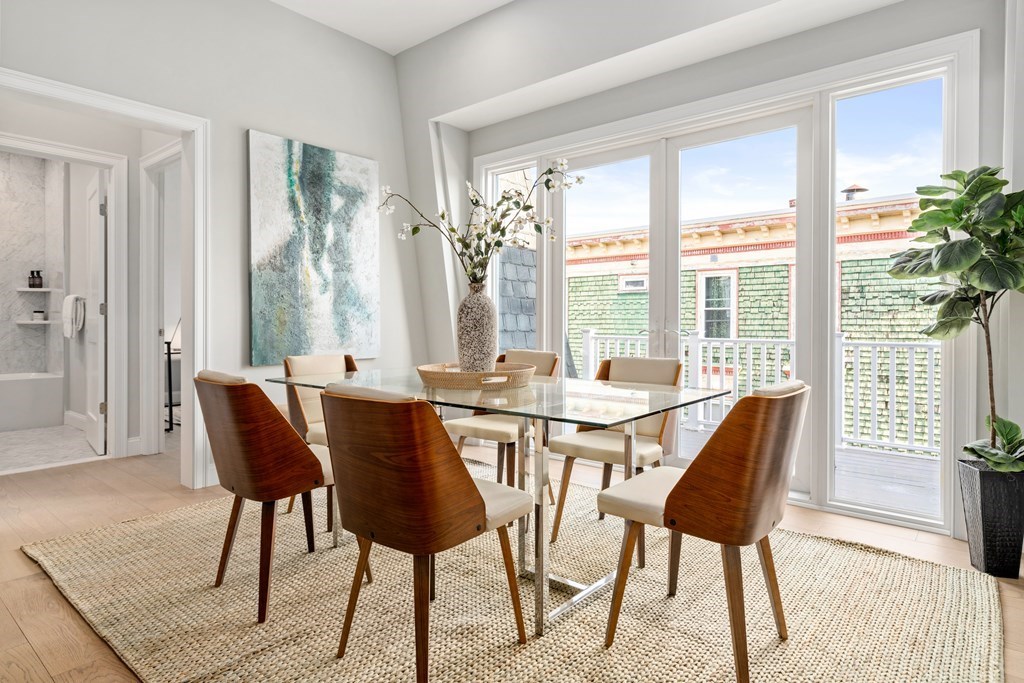 54 Pleasant Street, Unit 5 Boston, MA 02125 - Photo 12 of 23 a view of a dining room with furniture window and outside view