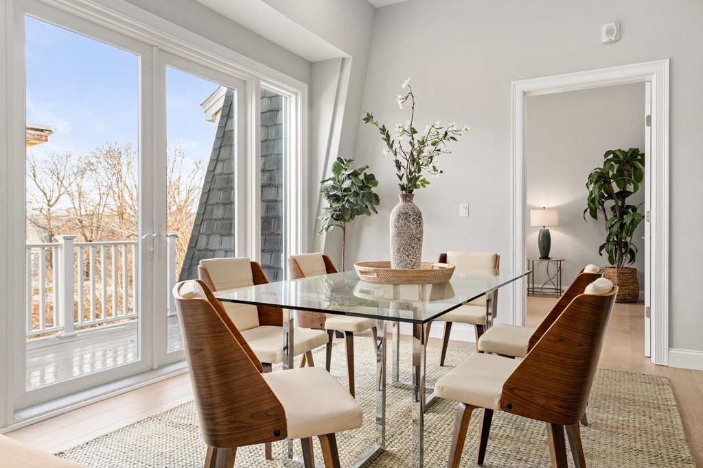 54 Pleasant Street, Unit 5 Boston, MA 02125 - Photo 14 of 23 a view of a dining room with furniture window and wooden floor