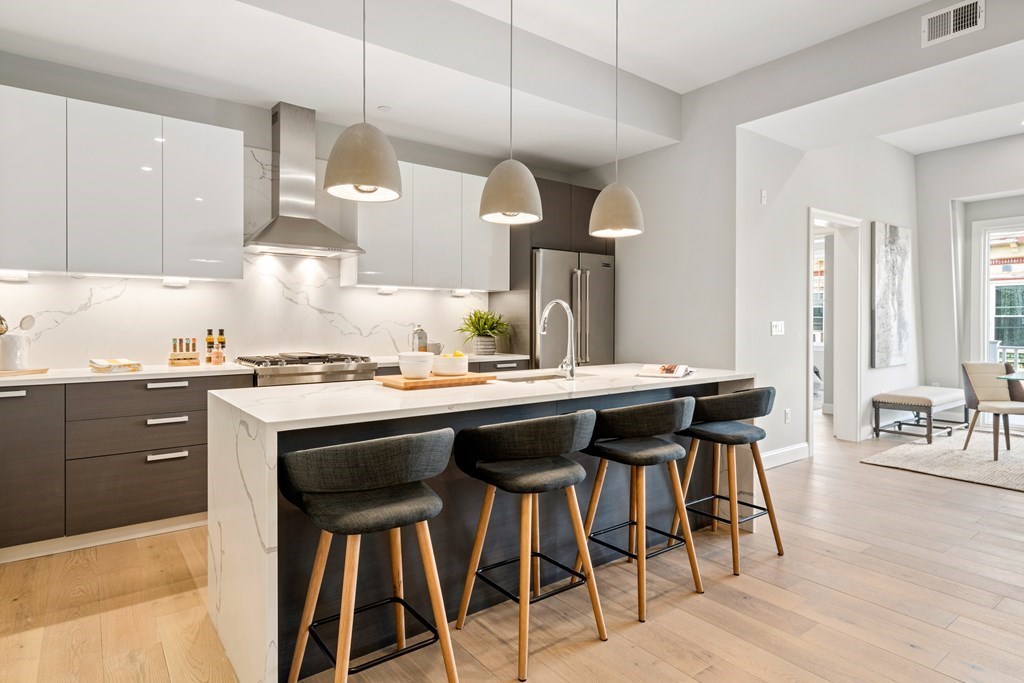 54 Pleasant Street, Unit 5 Boston, MA 02125 - Photo 17 of 23 a kitchen with a table and chairs in it