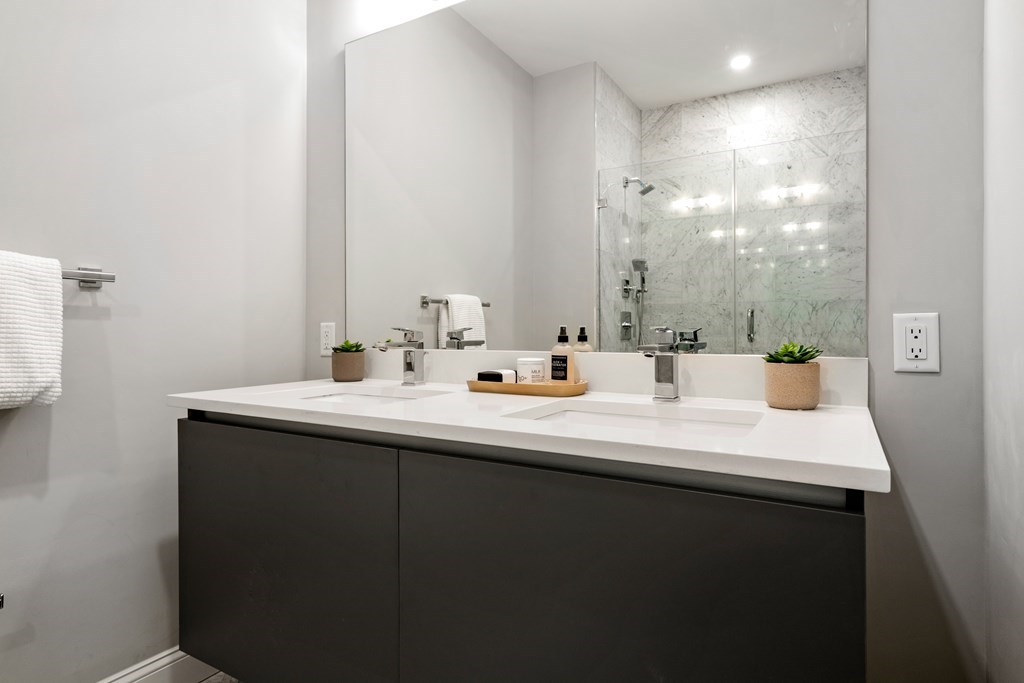 54 Pleasant Street, Unit 5 Boston, MA 02125 - Photo 5 of 23 a bathroom with a sink and a mirror