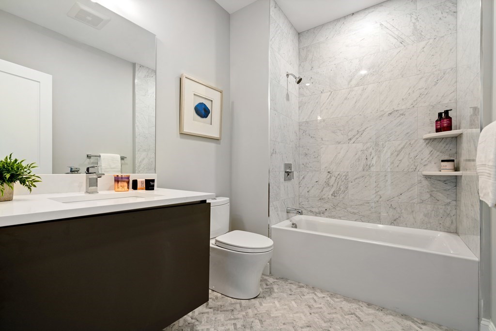 54 Pleasant Street, Unit 5 Boston, MA 02125 - Photo 10 of 23 a bathroom with a sink toilet and shower