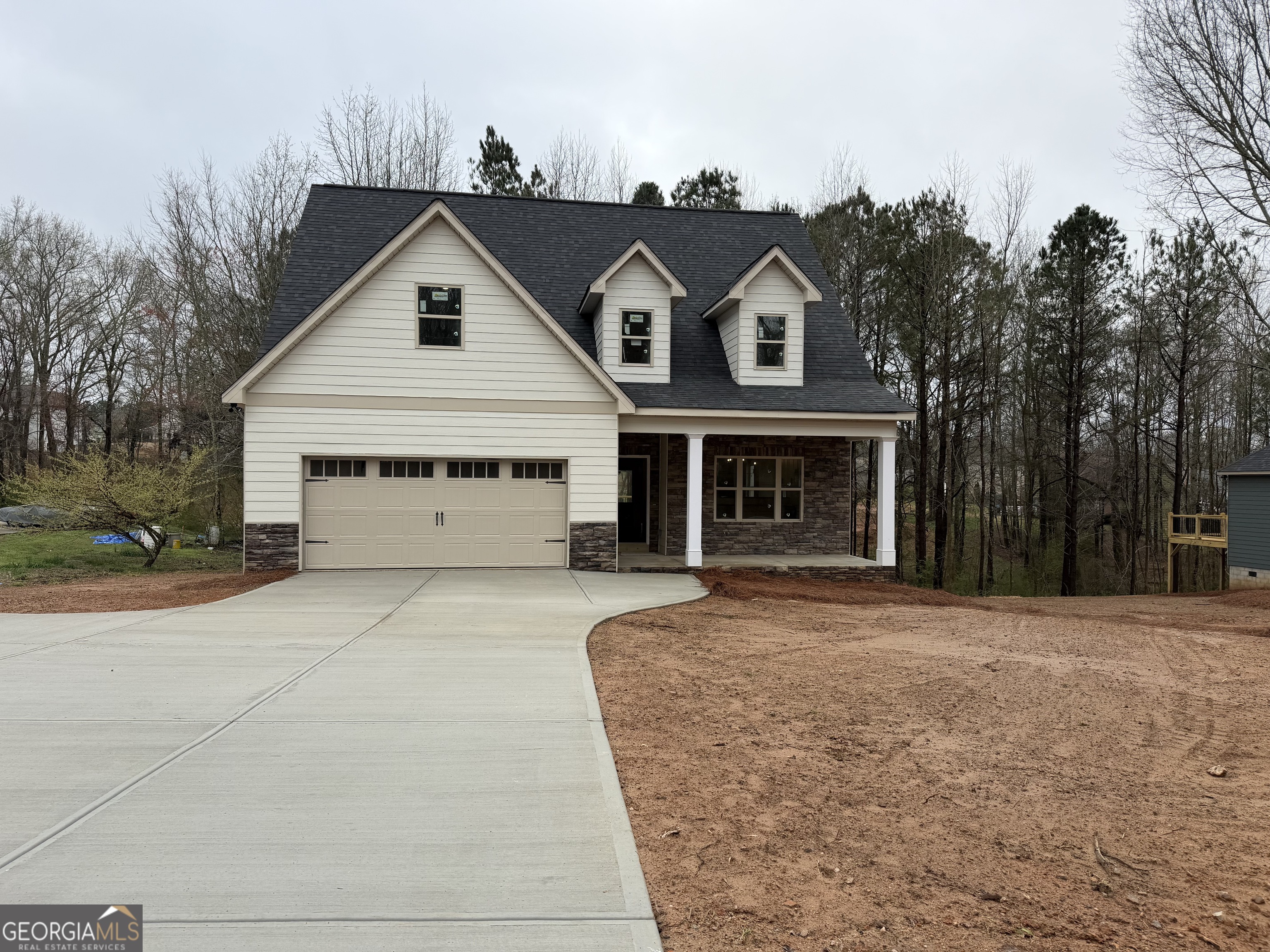 981 Horsley Mill Road Carrollton, GA 30116 - Photo 1 of 9 a front view of a house with a yard and garage
