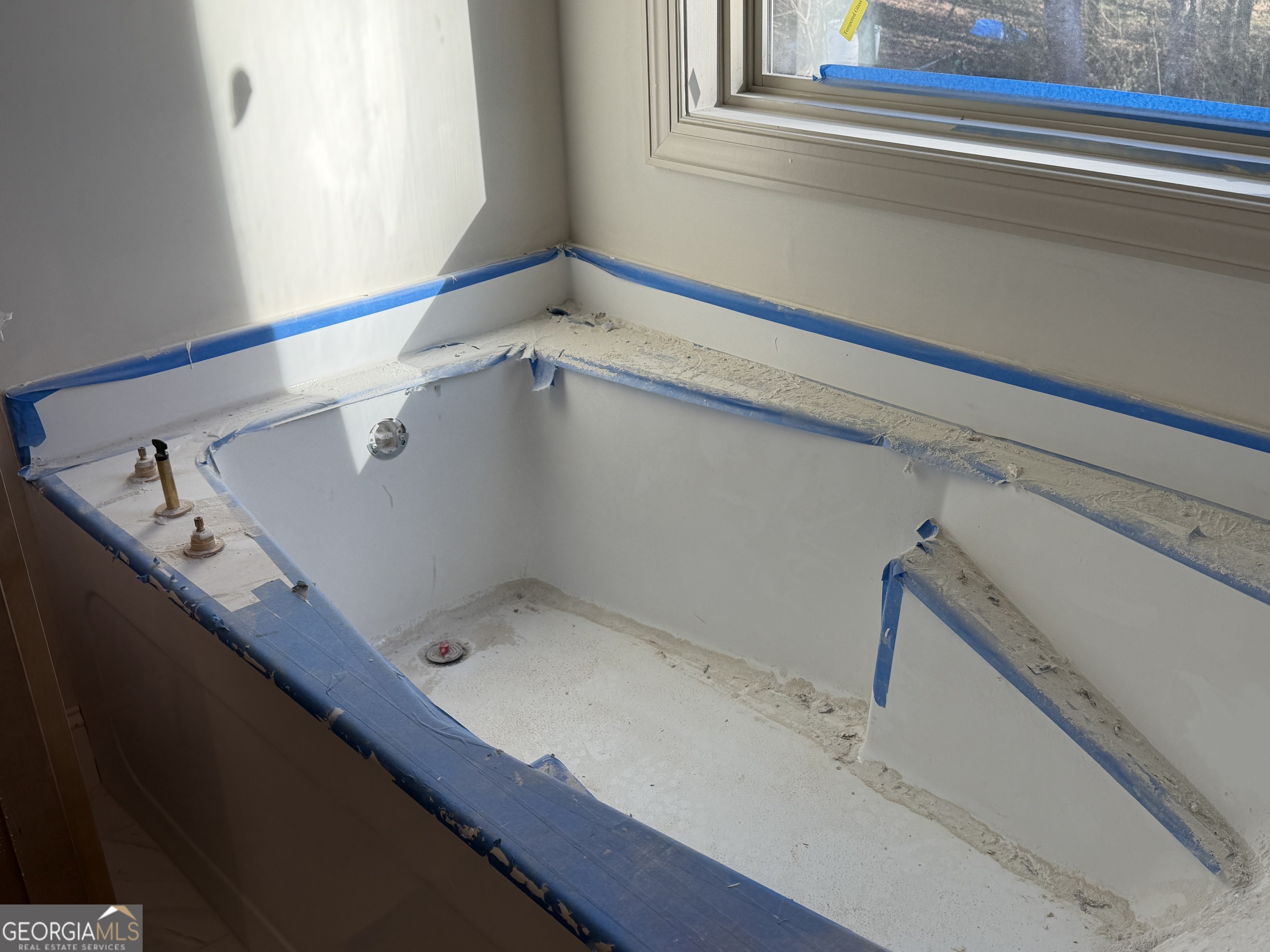 981 Horsley Mill Road Carrollton, GA 30116 - Photo 8 of 9 a bathroom with a sink and a window