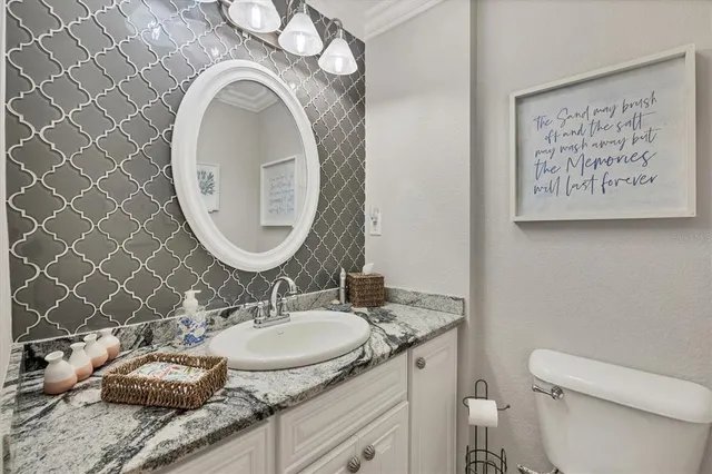 a bedroom with a bed and ceiling fan