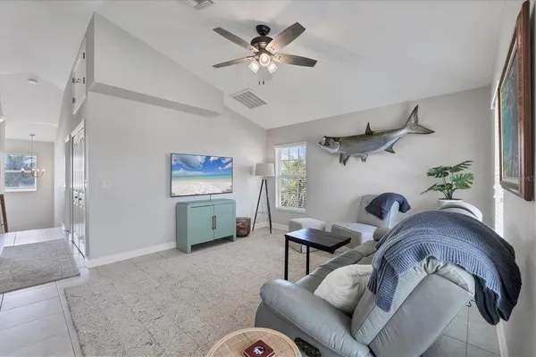 a bedroom with a bed a couch and a window