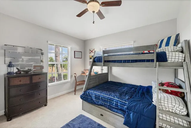 a bedroom with furniture and wooden floor